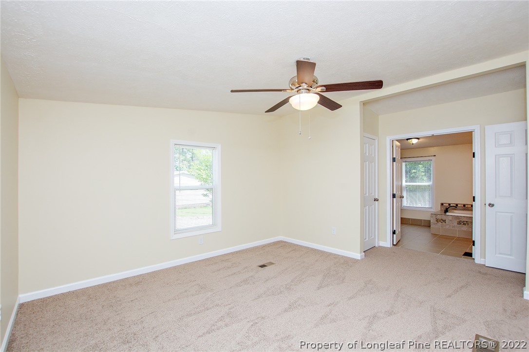 246 Loop Road Raeford, NC 28376 - Photo 29 of 42 wooden floor in an empty room with a window