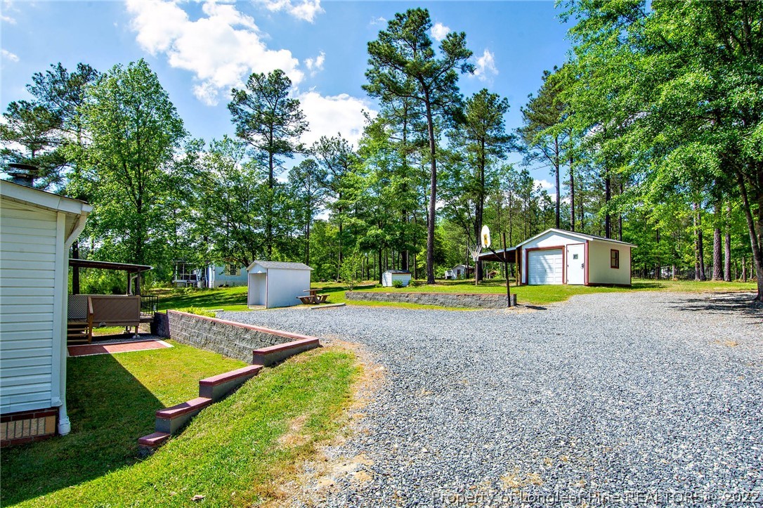 246 Loop Road Raeford, NC 28376 - Photo 36 of 42 a view of a park with large trees