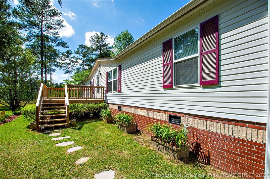 246 Loop Road Raeford, NC 28376 - Photo 4 of 42 a view of a house with a yard