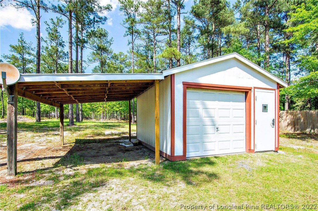 246 Loop Road Raeford, NC 28376 - Photo 42 of 42 a backyard of a house with table and chairs