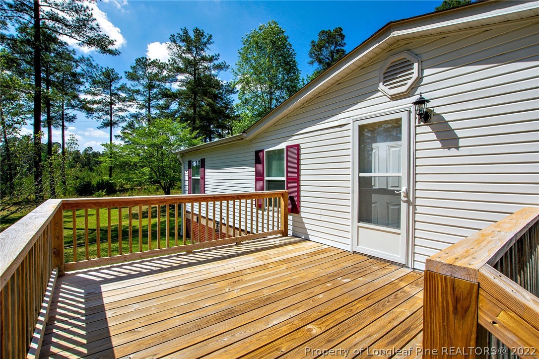246 Loop Road Raeford, NC 28376 - Photo 5 of 42 a view of a wooden deck