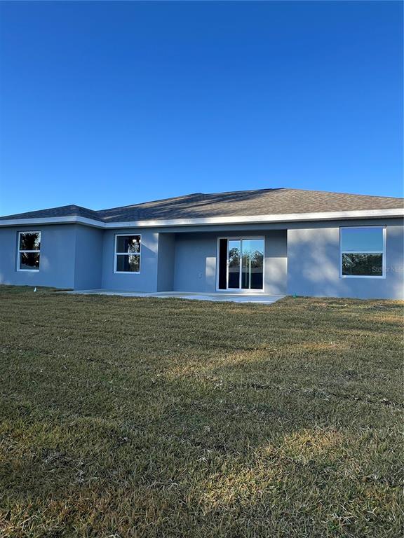 55 Northwest 45th Loop Ocala, FL 34475 - Photo 18 of 20 a front view of house with yard