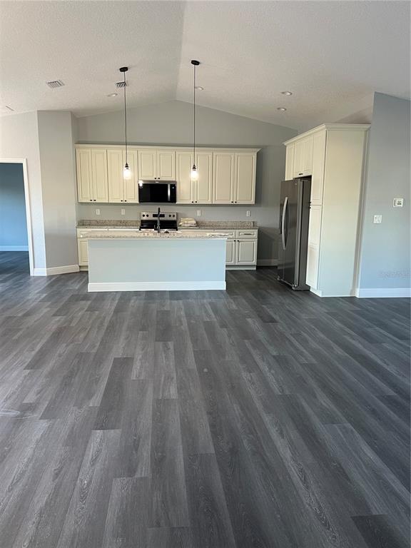 55 Northwest 45th Loop Ocala, FL 34475 - Photo 6 of 20 a view of a kitchen with a sink and wooden floor