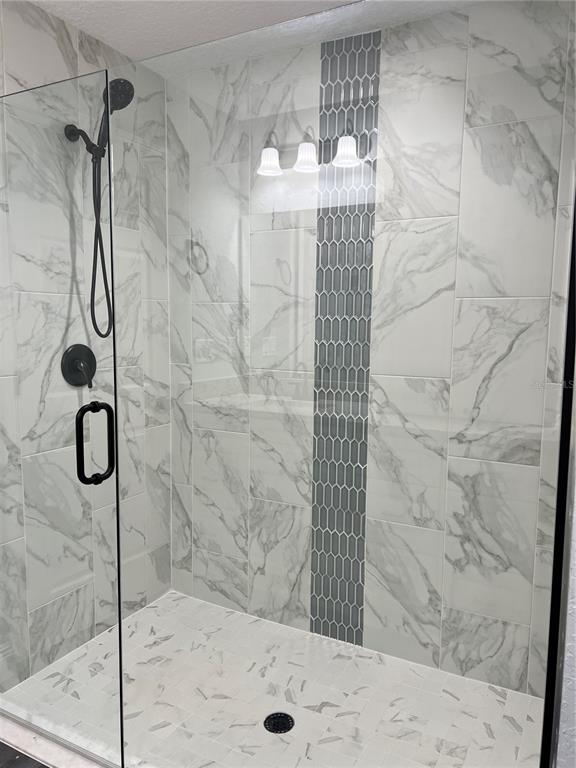 55 Northwest 45th Loop Ocala, FL 34475 - Photo 10 of 20 a bathroom with a shower