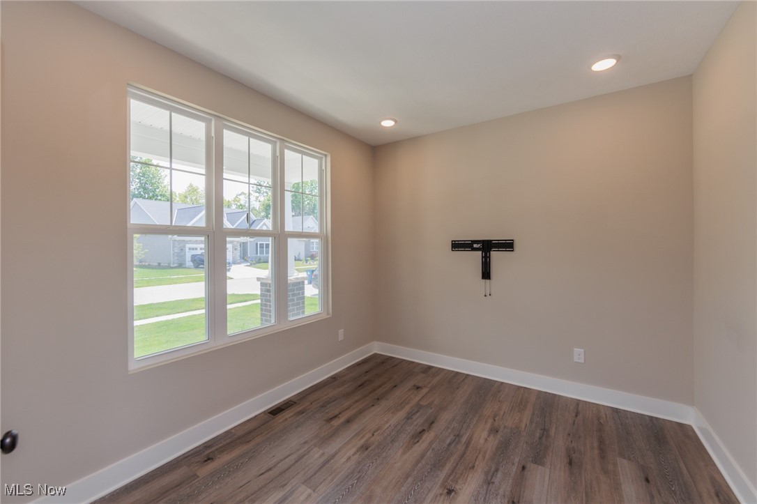 36458 Appian Way North Ridgeville, OH 44039 - Photo 4 of 37 Unfurnished room with dark hardwood / wood-style floors