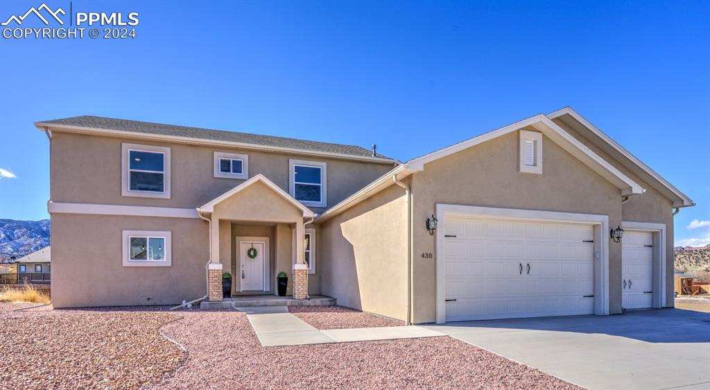 a front view of a house with yard