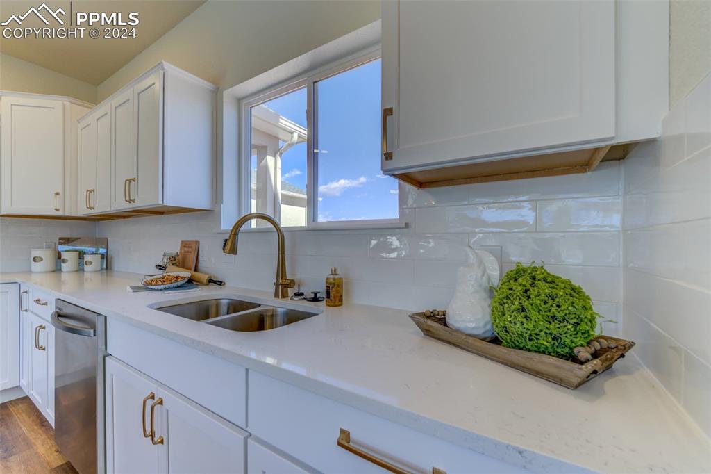 430 Miners Road Canon City, CO 81212 - Photo 14 of 50 a kitchen with a sink cabinets and potted plant