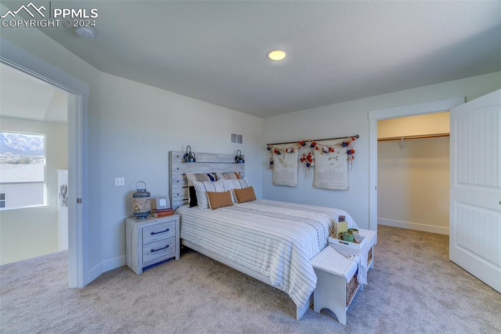 430 Miners Road Canon City, CO 81212 - Photo 18 of 50 a bedroom with a bed and a view of bedroom