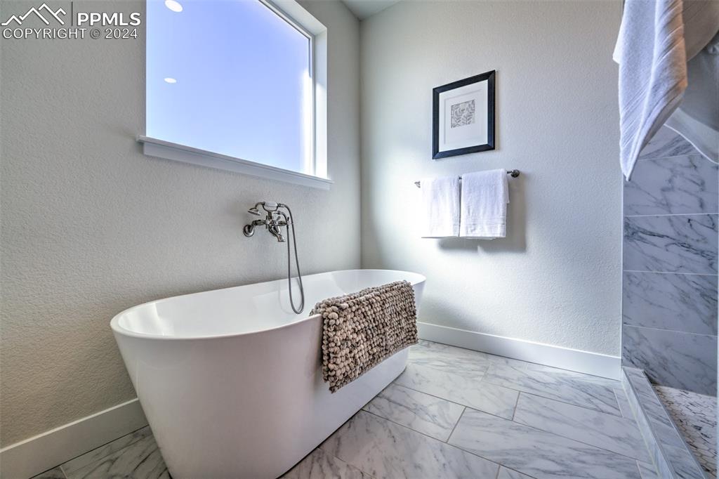 430 Miners Road Canon City, CO 81212 - Photo 22 of 50 a white tub sitting in a bathroom