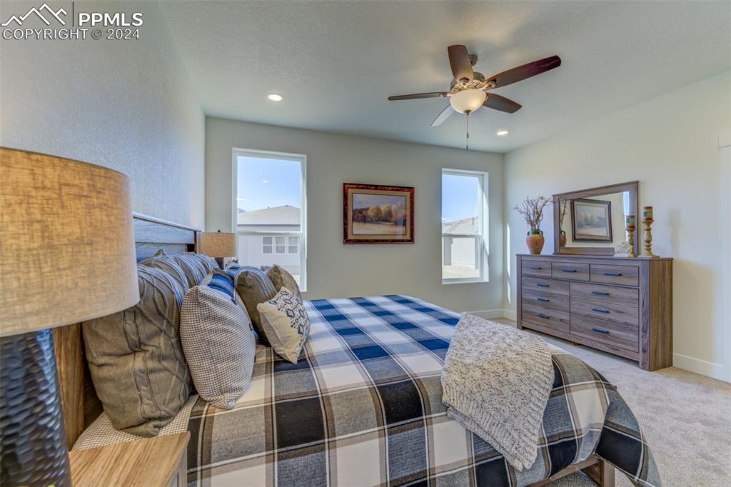 430 Miners Road Canon City, CO 81212 - Photo 24 of 50 a bed room with a bed and a chandelier