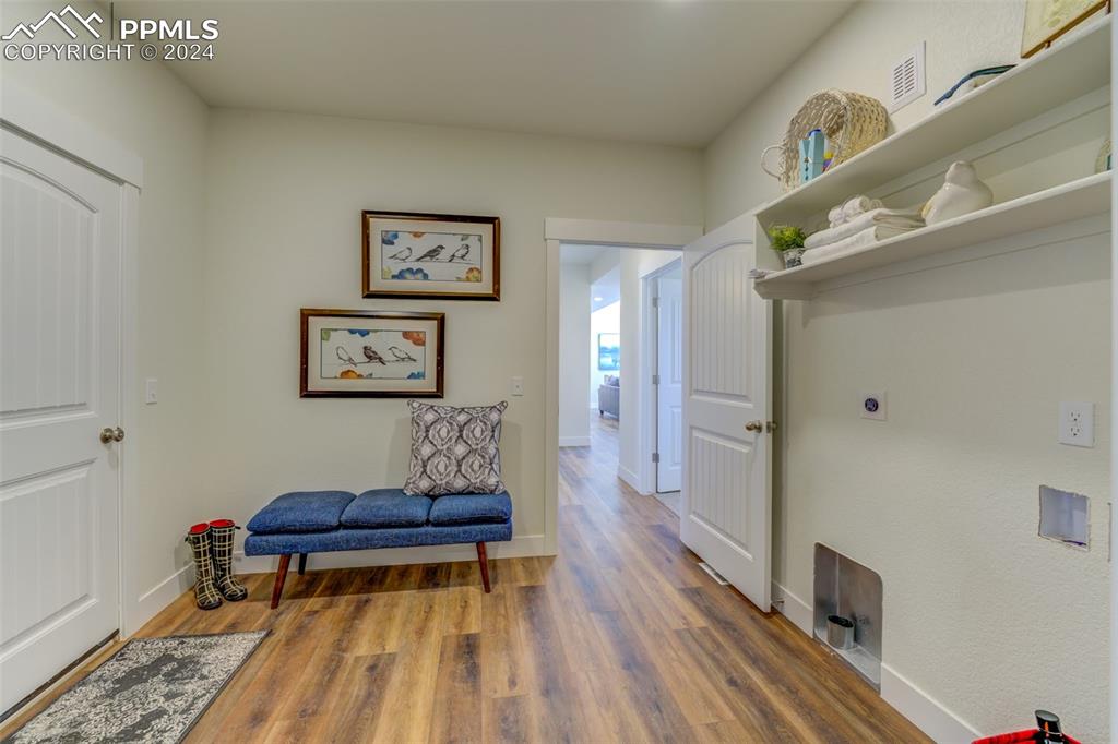 430 Miners Road Canon City, CO 81212 - Photo 29 of 50 a living room with a couch and paintings on the wall
