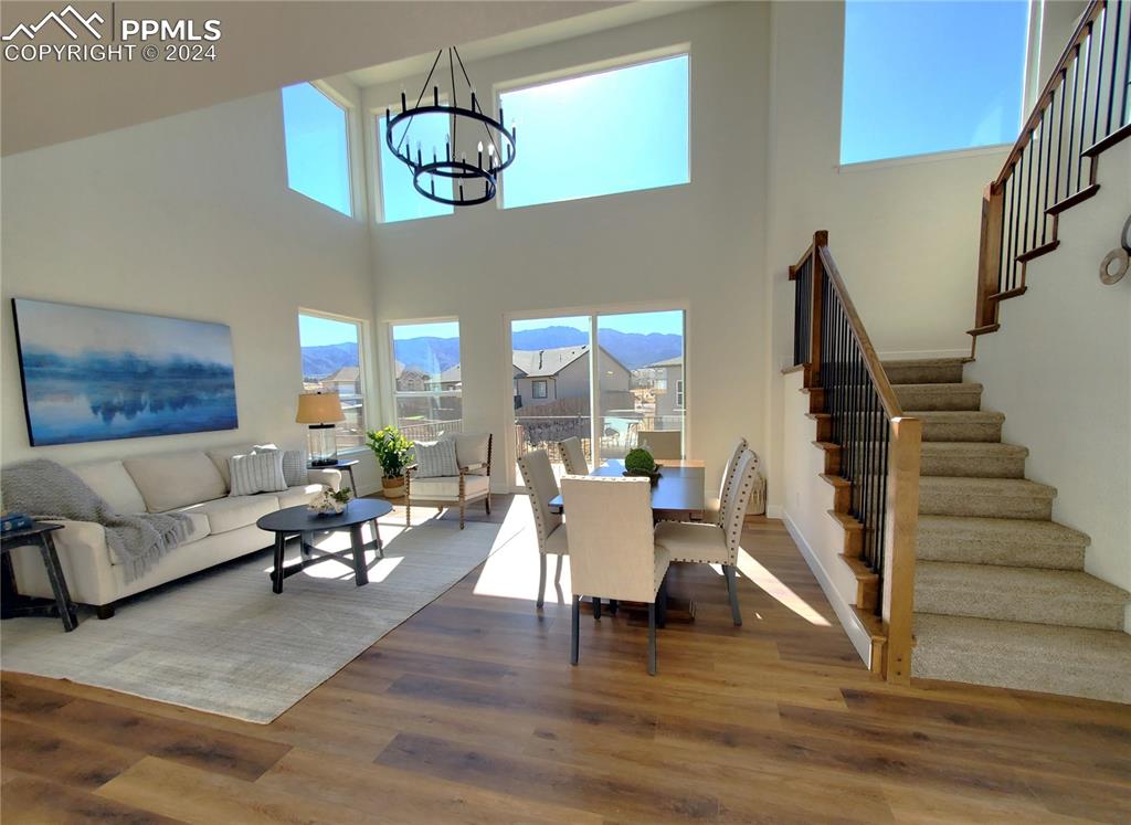 430 Miners Road Canon City, CO 81212 - Photo 31 of 50 a living room with furniture dining table and a chandelier