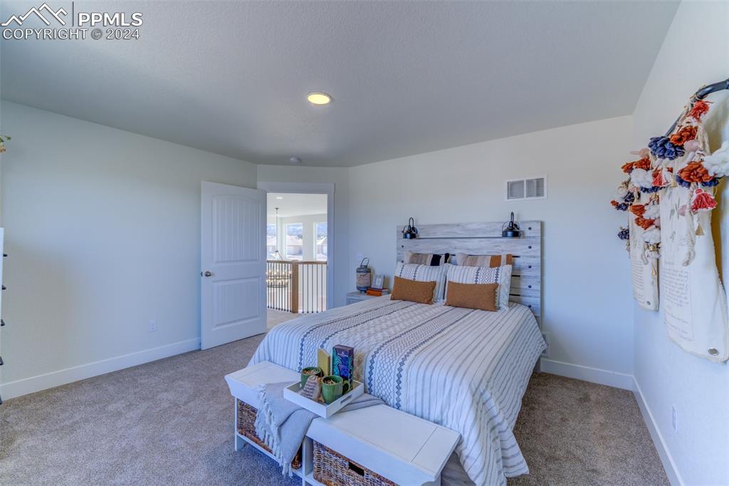 430 Miners Road Canon City, CO 81212 - Photo 37 of 50 a bedroom with a bed and a dresser