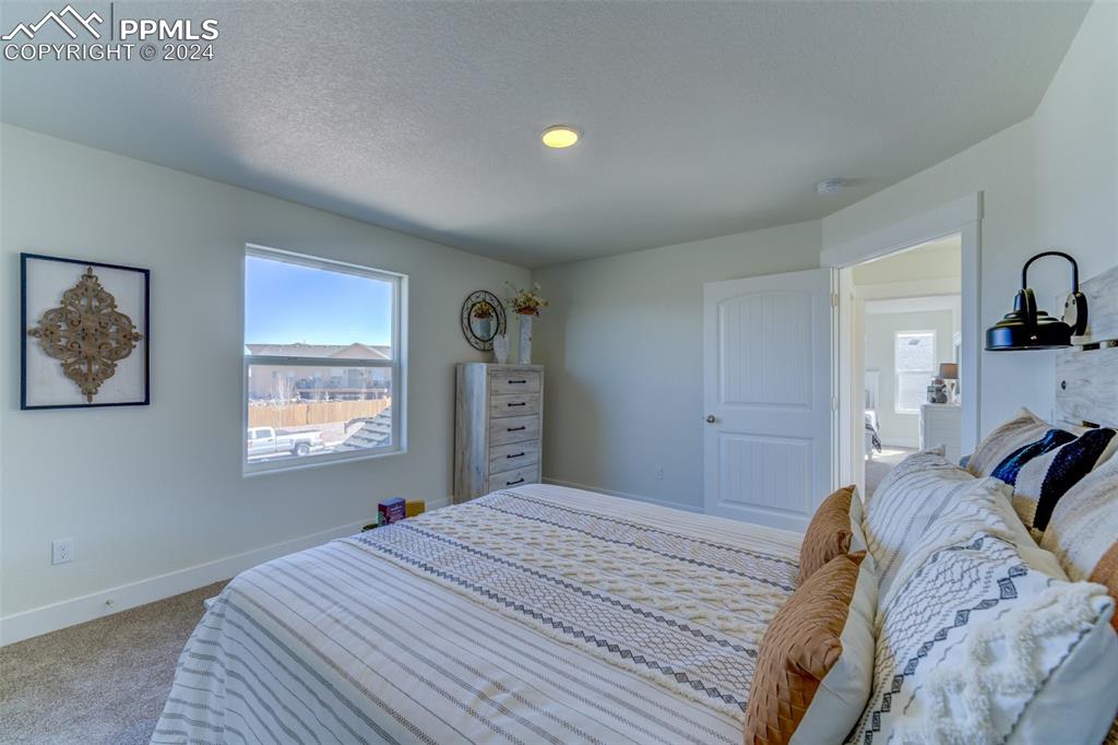430 Miners Road Canon City, CO 81212 - Photo 38 of 50 a bedroom with a bed and a window