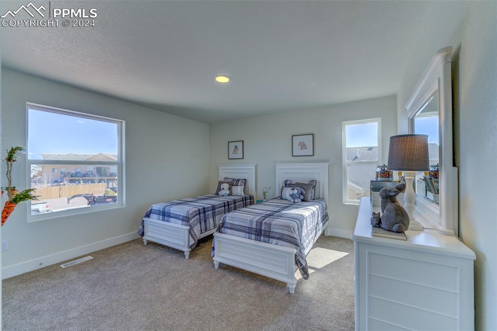 430 Miners Road Canon City, CO 81212 - Photo 41 of 50 a bedroom with a bed and wooden floor
