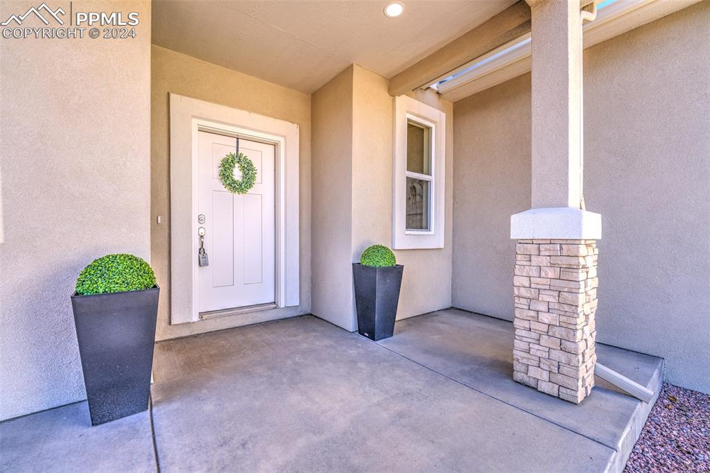 430 Miners Road Canon City, CO 81212 - Photo 42 of 50 a view of an empty room with a window and wooden floor