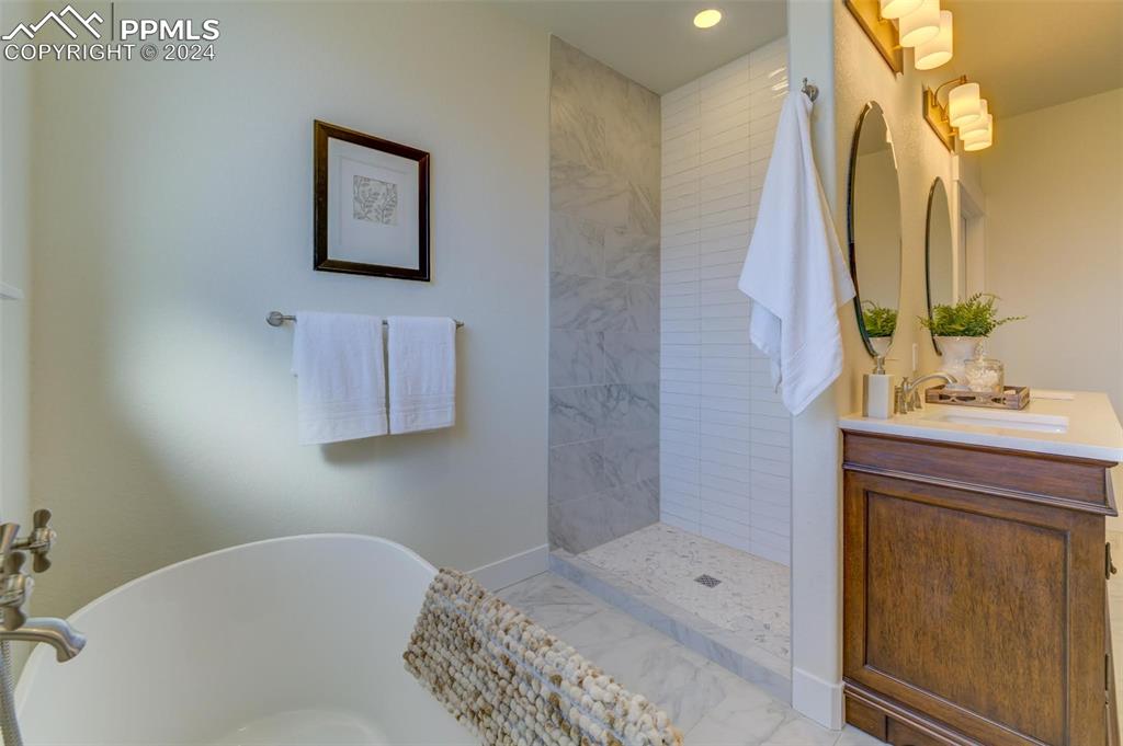 430 Miners Road Canon City, CO 81212 - Photo 5 of 50 a bathroom with a bathtub sink and mirror