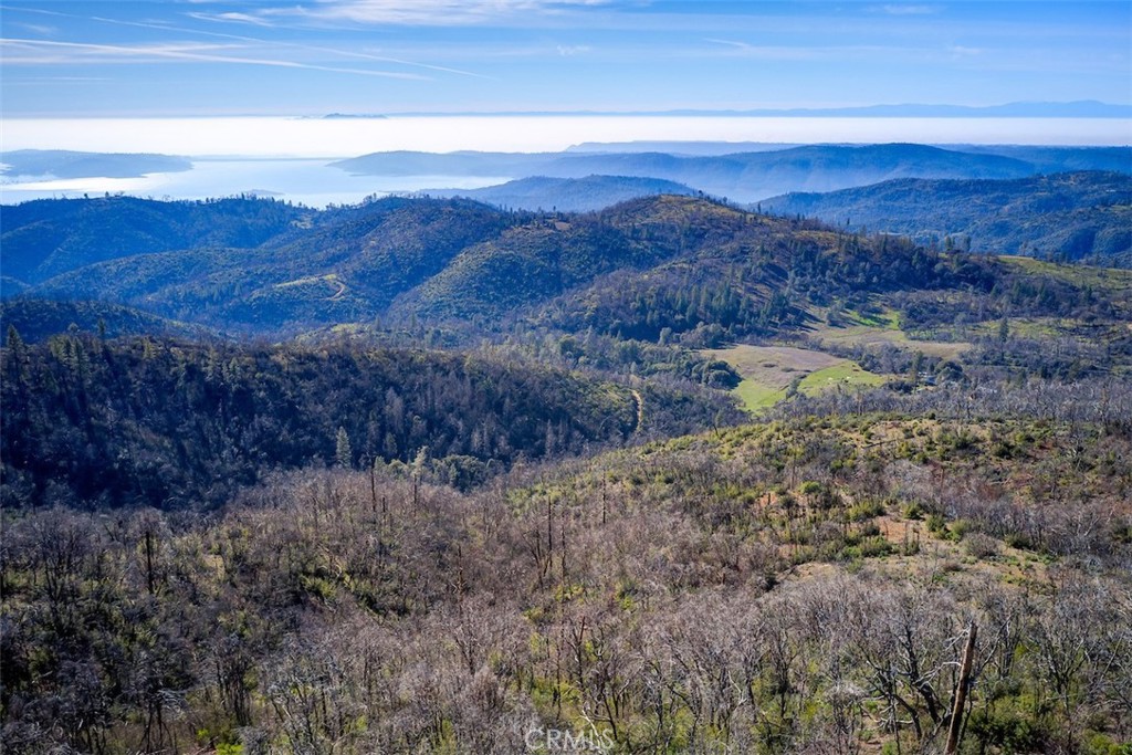 0 Big Ridge Road Berry Creek, CA 95916 - Photo 12 of 17 a view of a lake with mountains in the background