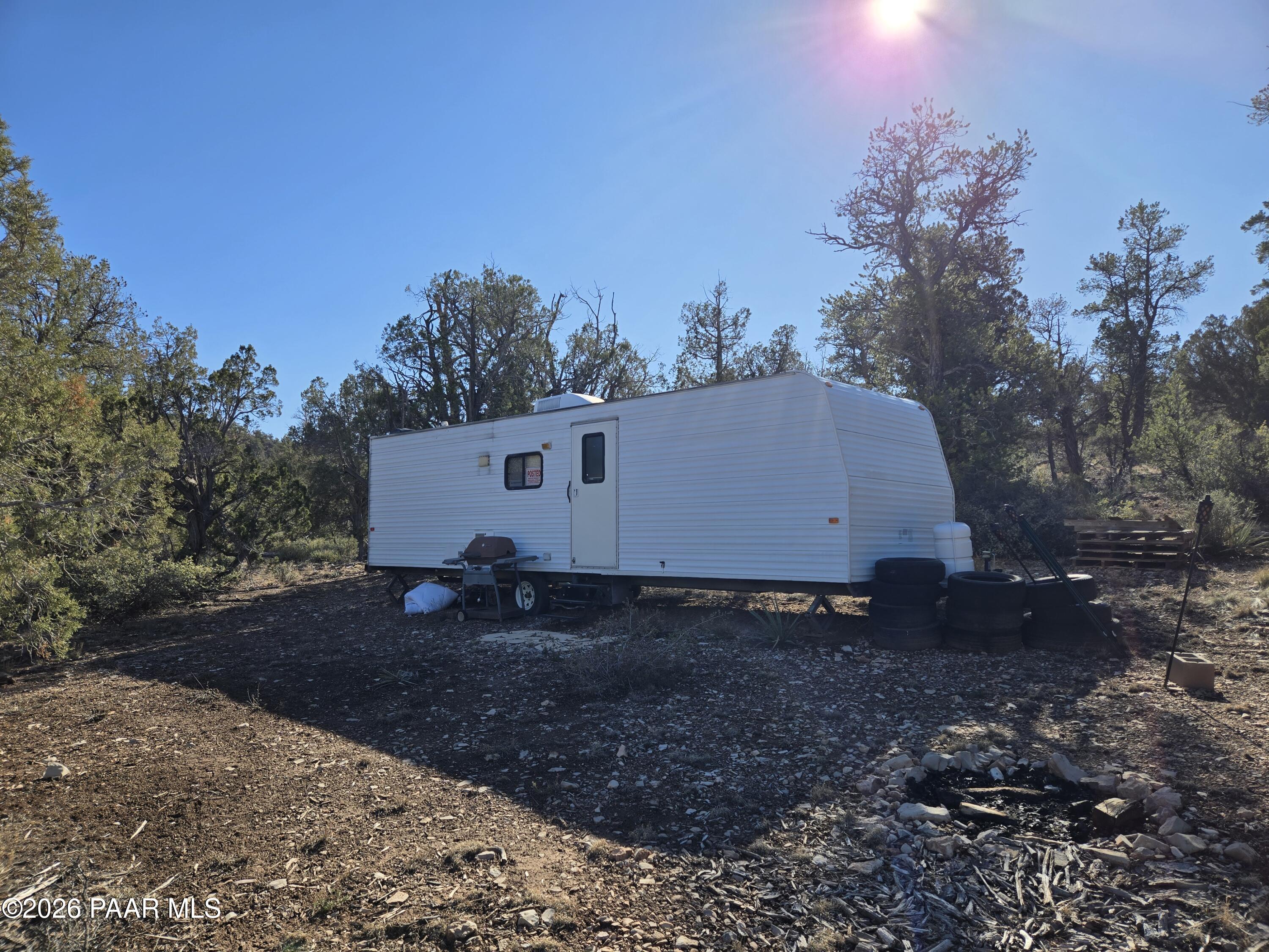138 Arizona Road Ash Fork, AZ 86320 - Photo 1 of 21 a view of a barn in the middle of a yard