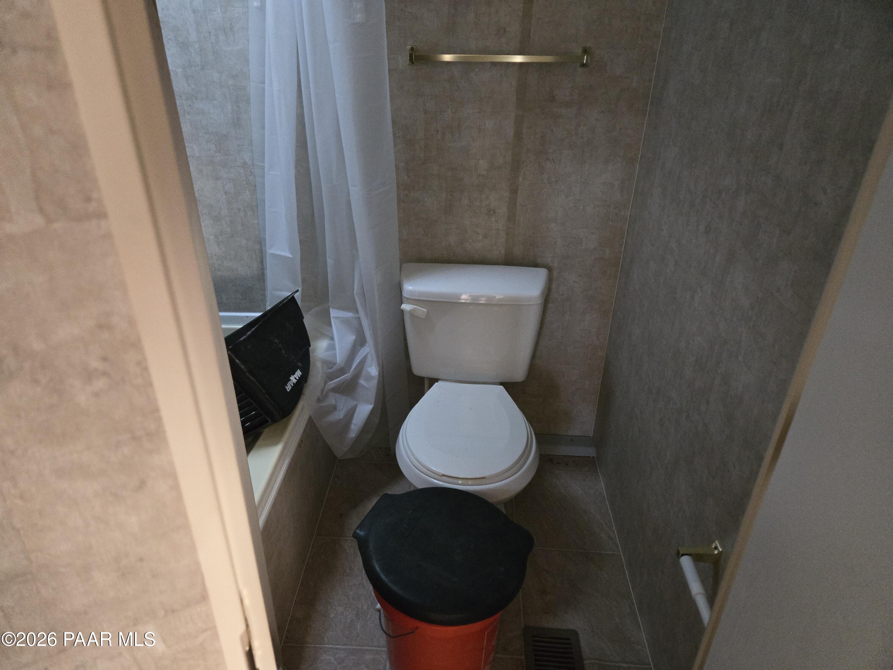 138 Arizona Road Ash Fork, AZ 86320 - Photo 11 of 21 a toilet sitting in a bathroom next to a sink