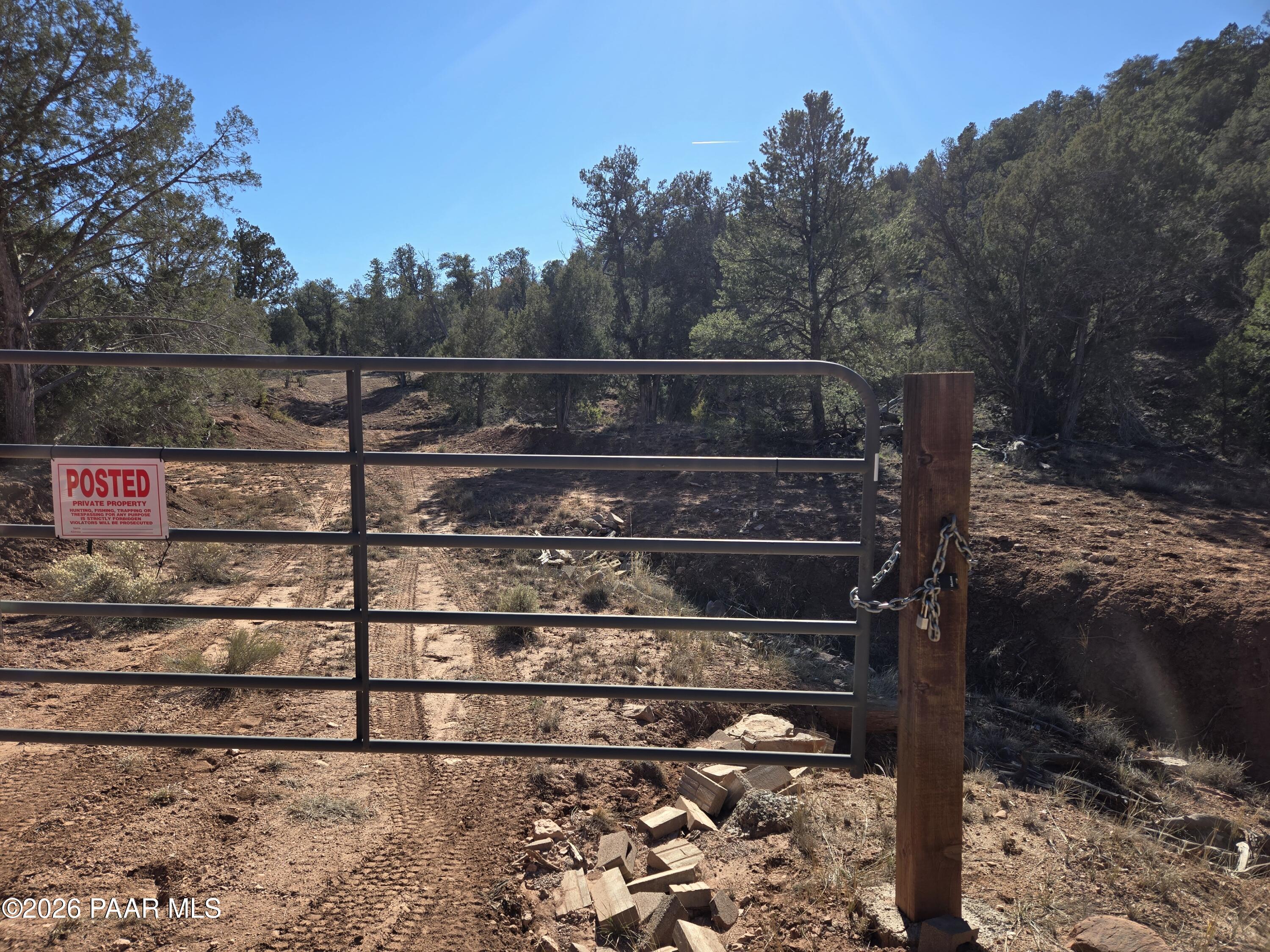 138 Arizona Road Ash Fork, AZ 86320 - Photo 19 of 21 a view of a wooden fence with a tree