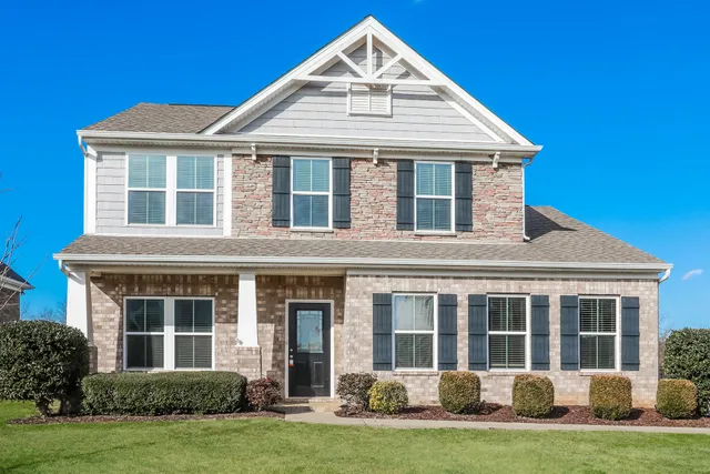 front view of a house with a yard