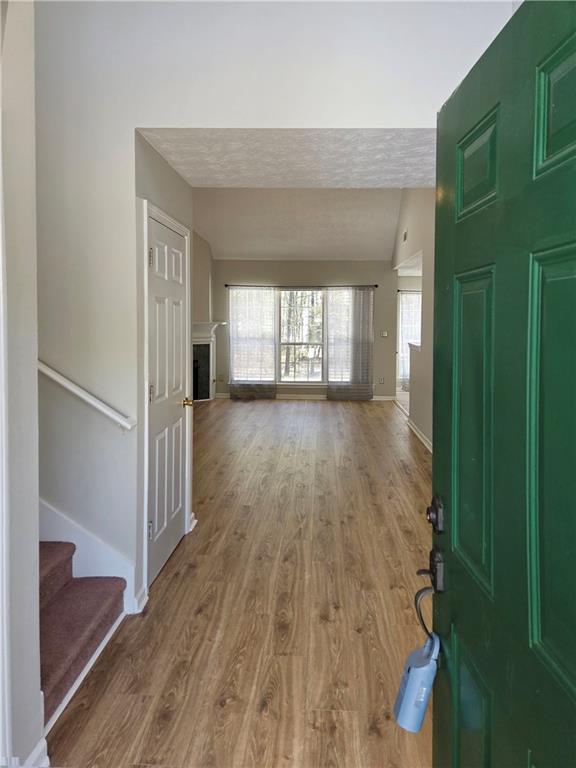 2575 Hamilton Parc Lane Northeast Buford, GA 30519 - Photo 11 of 63 a view of a room with wooden floor and a window