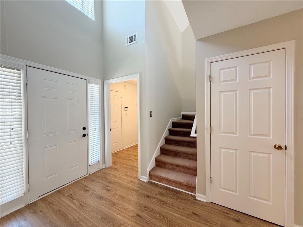 2575 Hamilton Parc Lane Northeast Buford, GA 30519 - Photo 16 of 63 a view of a hallway with wooden floor and entryway