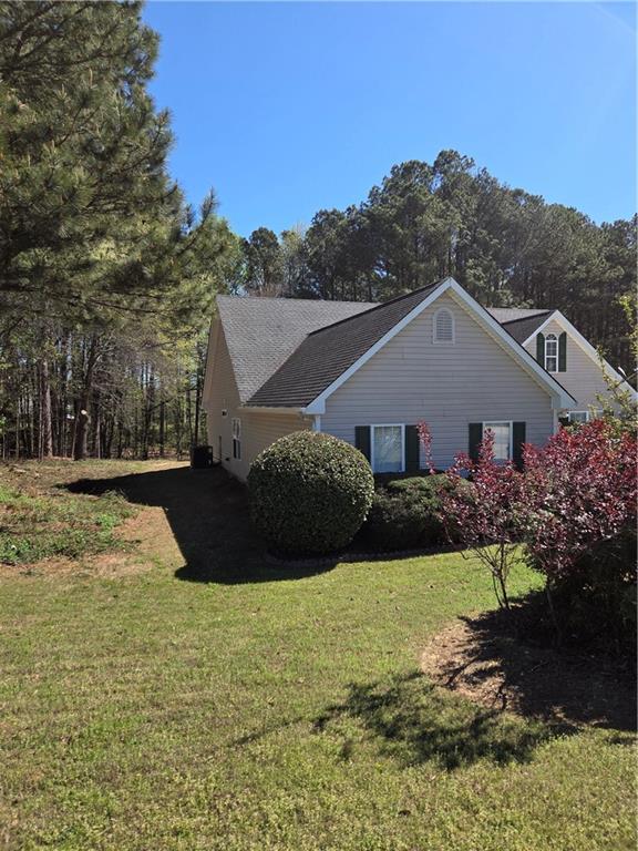 2575 Hamilton Parc Lane Northeast Buford, GA 30519 - Photo 2 of 63 a front view of a house with a yard