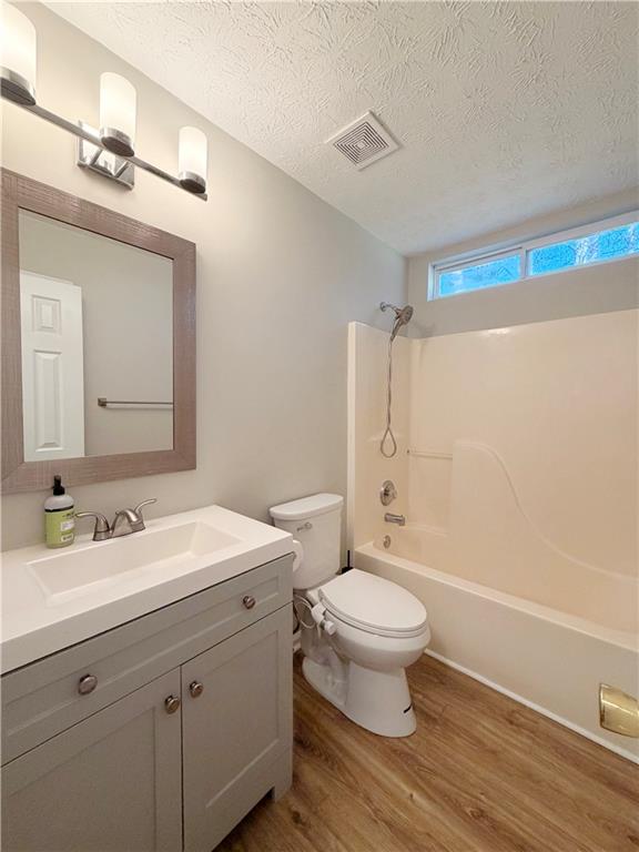 2575 Hamilton Parc Lane Northeast Buford, GA 30519 - Photo 29 of 63 a bathroom with a sink a toilet and shower