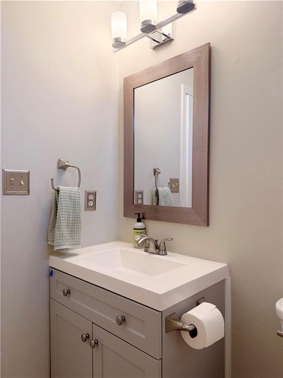 2575 Hamilton Parc Lane Northeast Buford, GA 30519 - Photo 30 of 63 a bathroom with a sink vanity and a mirror