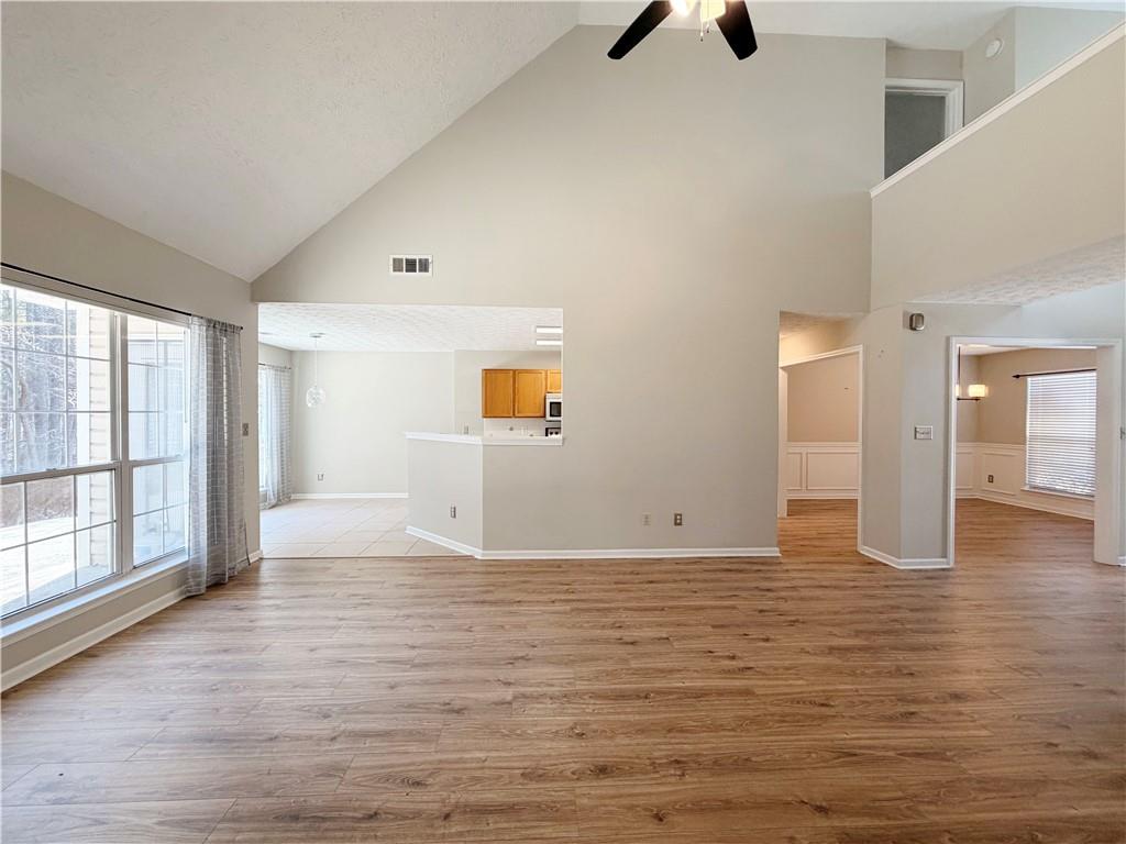 2575 Hamilton Parc Lane Northeast Buford, GA 30519 - Photo 38 of 63 a view of an empty room with window and wooden floor