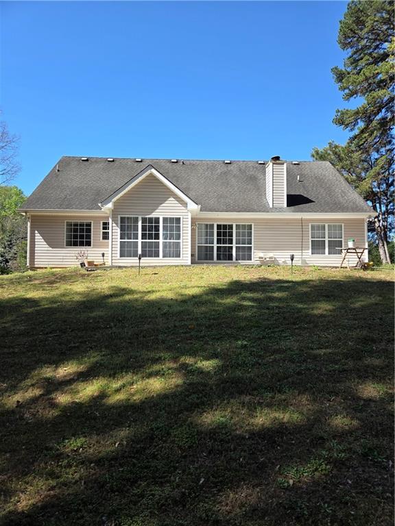 2575 Hamilton Parc Lane Northeast Buford, GA 30519 - Photo 5 of 63 a front view of a house with a garden