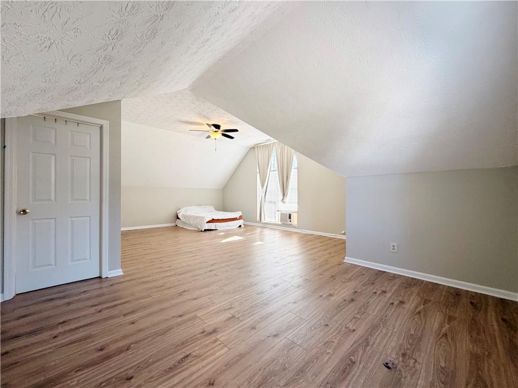 2575 Hamilton Parc Lane Northeast Buford, GA 30519 - Photo 53 of 63 a view of a livingroom with wooden floor