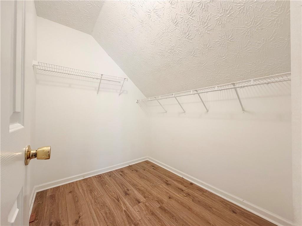 2575 Hamilton Parc Lane Northeast Buford, GA 30519 - Photo 56 of 63 a view of a room with racks on the wall