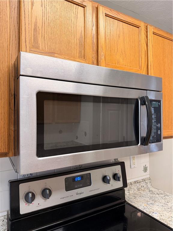 2575 Hamilton Parc Lane Northeast Buford, GA 30519 - Photo 63 of 63 a stove top oven sitting inside of a kitchen