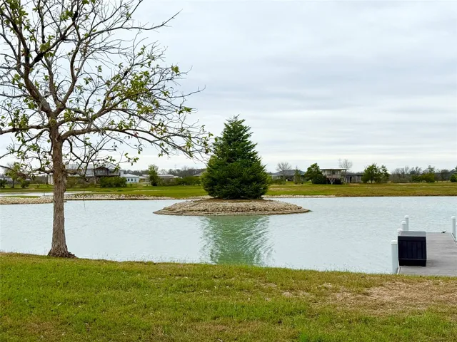 a view of a lake with a big yard
