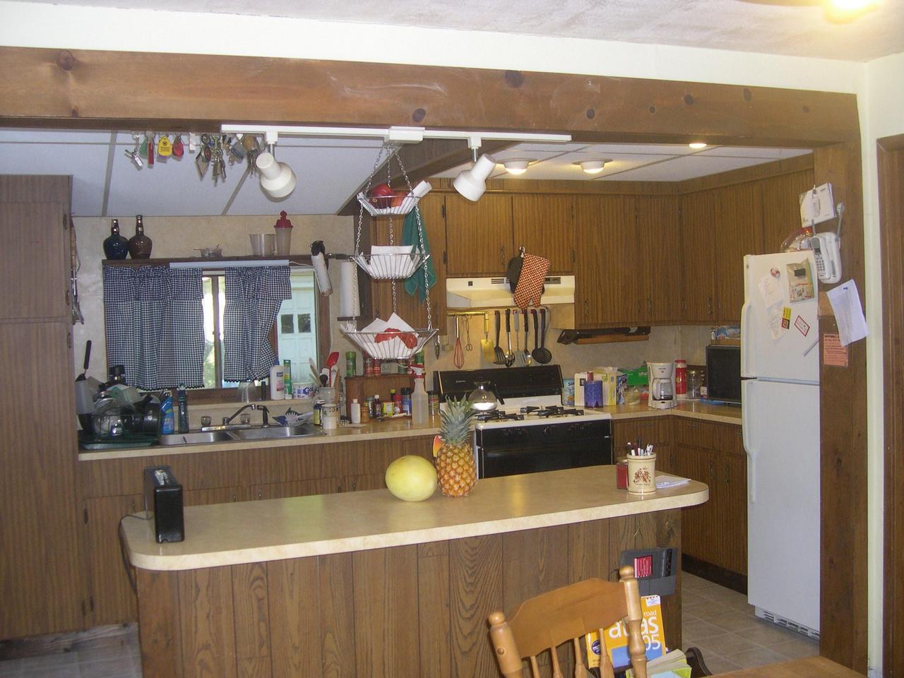 45039 Locust Ridge Road Pocono Lake, PA 18347 - Photo 3 of 9 a kitchen with a sink a stove and refrigerator