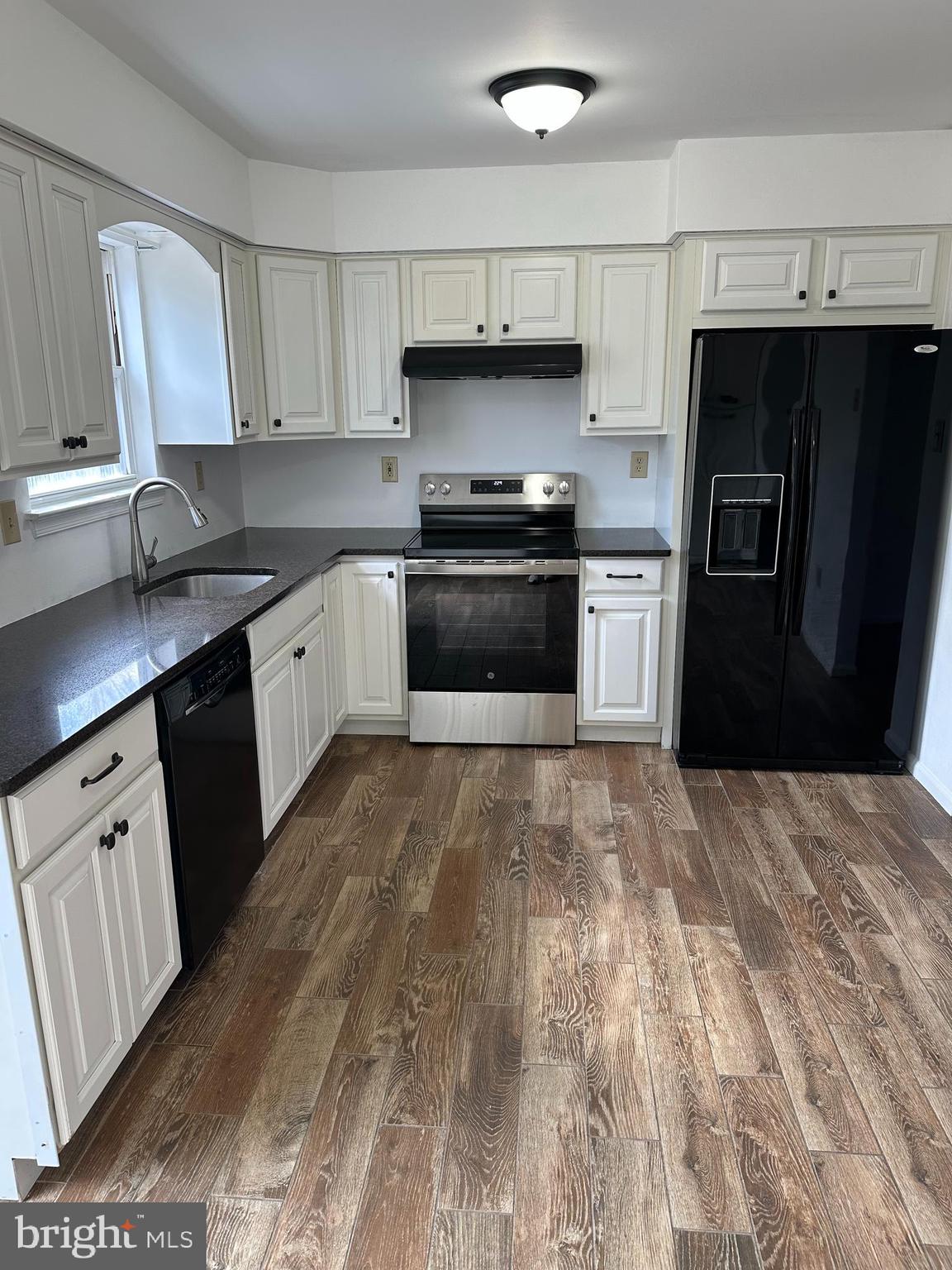 2073 Clover Mill Road Quakertown, PA 18951 - Photo 3 of 17 a kitchen with granite countertop a refrigerator stove and sink
