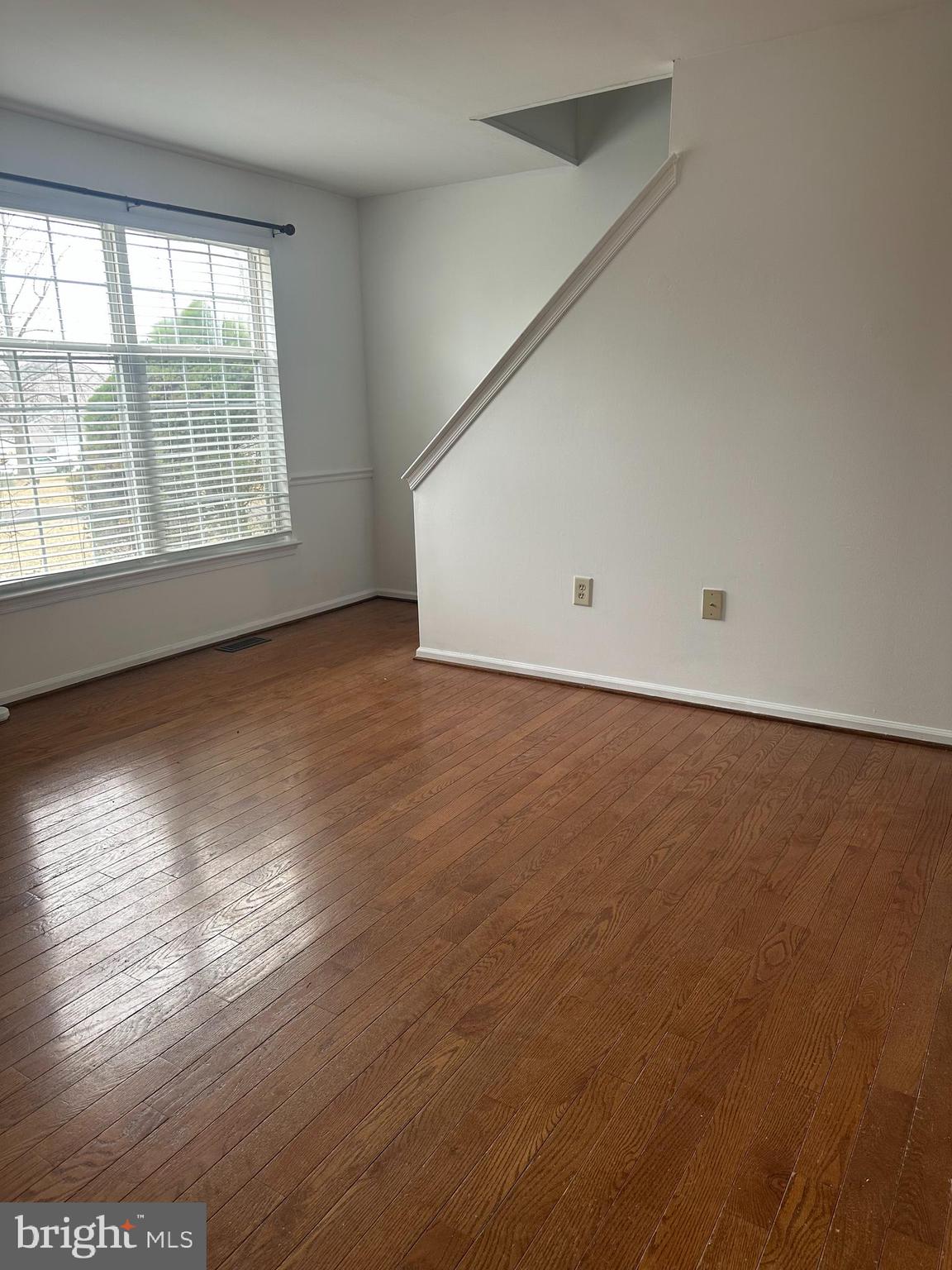 2073 Clover Mill Road Quakertown, PA 18951 - Photo 7 of 17 an empty room with wooden floor and windows