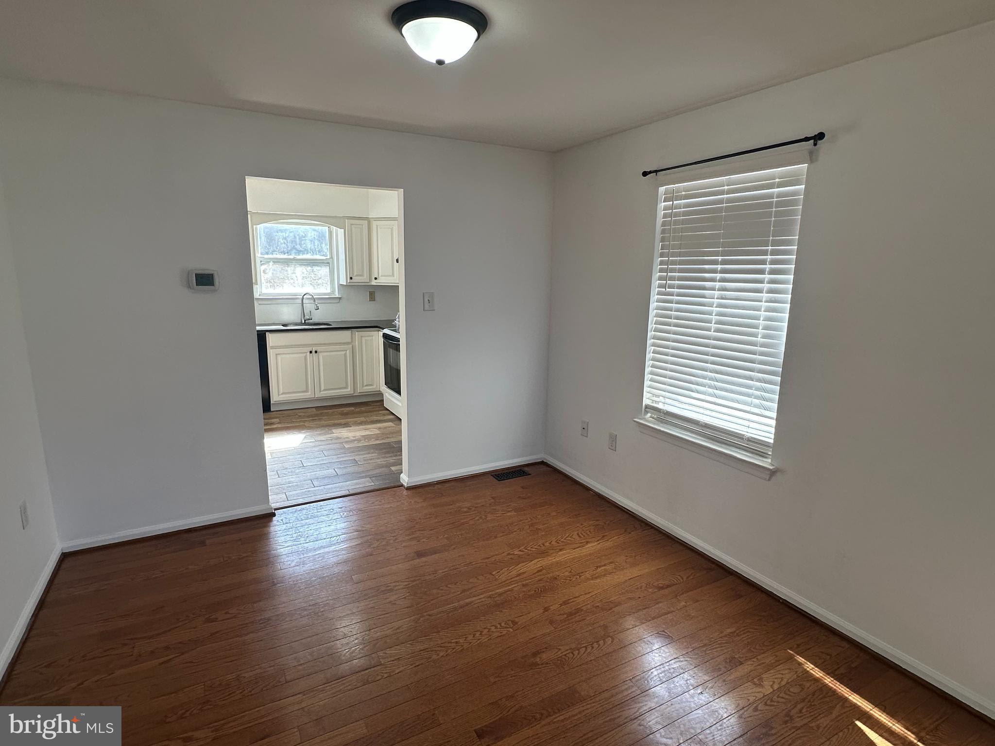 2073 Clover Mill Road Quakertown, PA 18951 - Photo 10 of 17 a view of empty room with wooden floor and fan