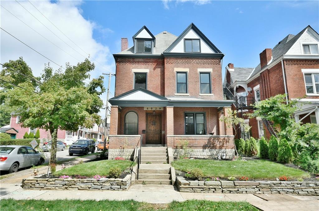 6029 Stanton Avenue Pittsburgh, PA 15206 - Photo 1 of 27 a front view of a house with a yard