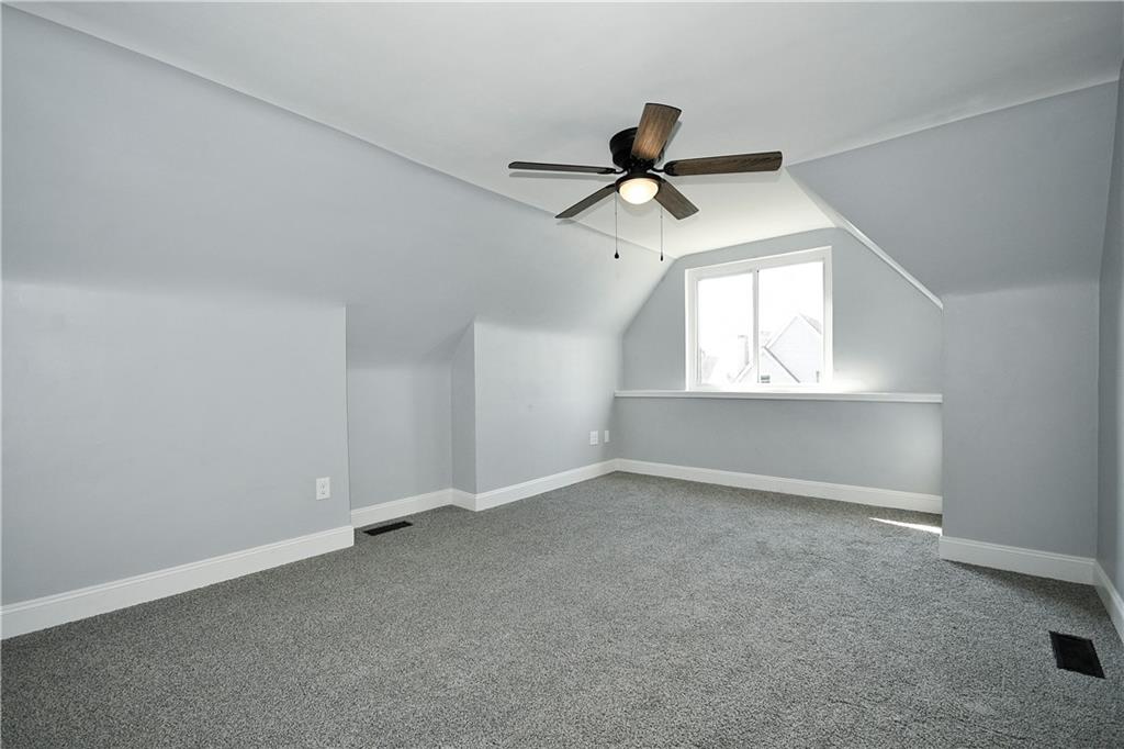 6029 Stanton Avenue Pittsburgh, PA 15206 - Photo 21 of 27 an empty room with a empty space and windows