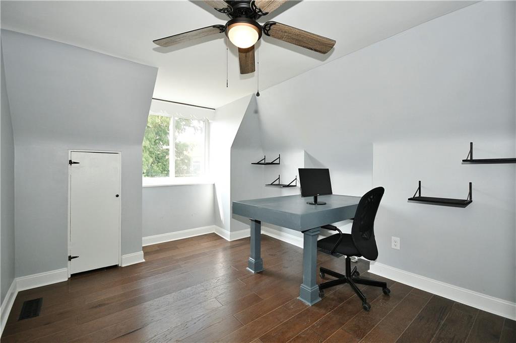 6029 Stanton Avenue Pittsburgh, PA 15206 - Photo 22 of 27 a workspace with wooden floor and a window