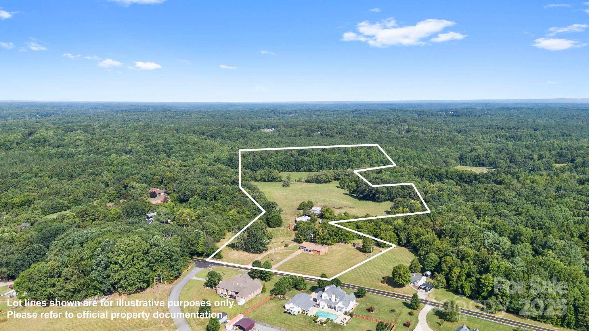906 East Monbo Road Statesville, NC 28677 - Photo 1 of 30 an aerial view of a house with swimming pool and mountain view