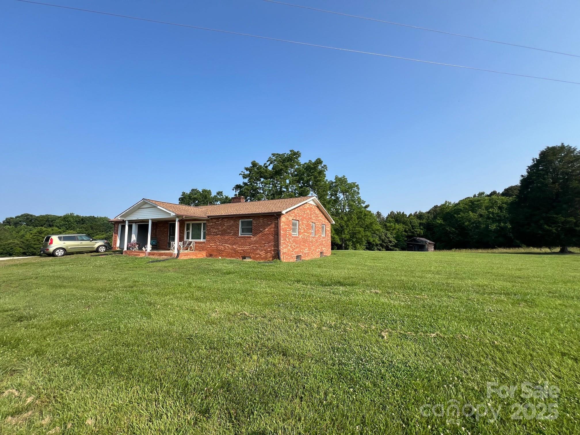 906 East Monbo Road Statesville, NC 28677 - Photo 23 of 30 a view of a big yard with a house in the background