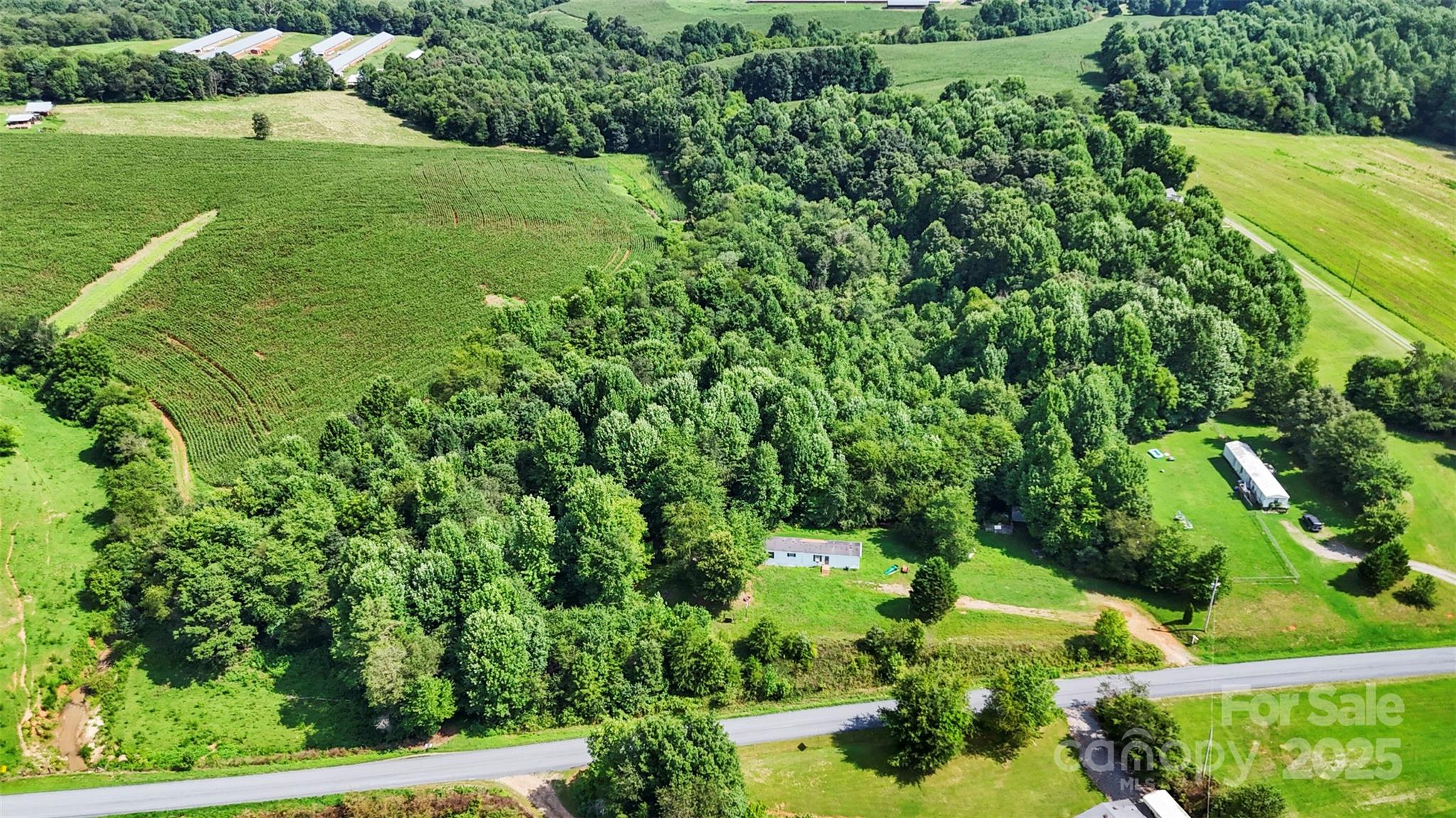 906 East Monbo Road Statesville, NC 28677 - Photo 28 of 30 a view of a garden with a building