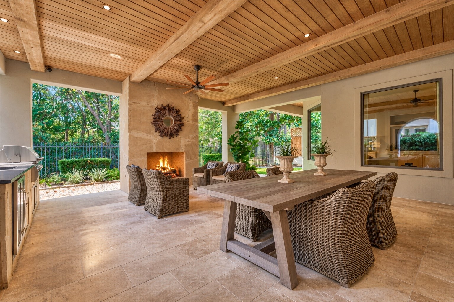 7 Dorset Square The Woodlands, TX 77381 - Photo 33 of 50 Extensive covered patio with dining, exterior living, outdoor kitchen, mosquito system and cozy outdoor fireplace.