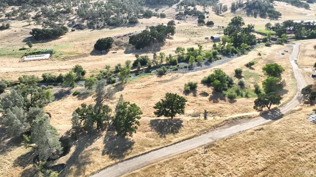 a view of a town with trees in the background