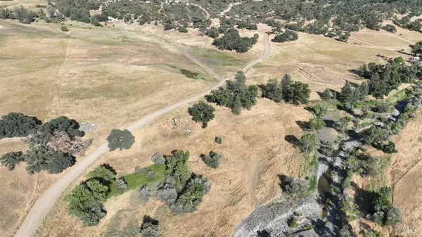 a view of a mountain with mountains in the background